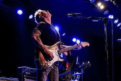 Singer leaning into microphone