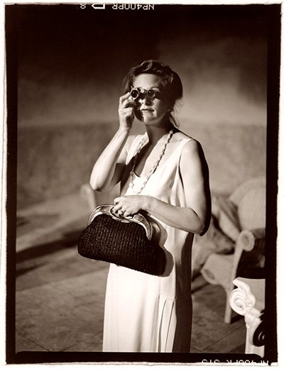 Actor holding book during stage play